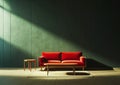 Modern soft red sofa against a background of an empty green wall. Minimalist interior of a modern room Royalty Free Stock Photo