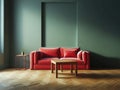 Modern soft red sofa against a background of an empty green wall. Minimalist interior of a modern room Royalty Free Stock Photo