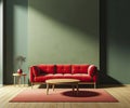 Modern soft red sofa against a background of an empty green wall. Minimalist interior of a modern room Royalty Free Stock Photo