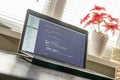 Modern software development background: nice looking laptop with programm
