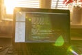 Modern software development background: nice looking laptop with programm