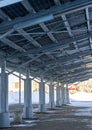 A solar carport for public vehicle parking is outfitted with solar panels Royalty Free Stock Photo