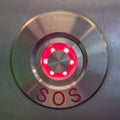 Modern SOS, help button made of stainless steel metal and illuminated glass indicator, details, closeup Royalty Free Stock Photo