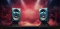 Modern sound speakers in neon light as background, closeup Royalty Free Stock Photo