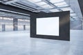 Modern spacious concrete warehouse garage interior with blank white mock up poster. Space and design concept. Royalty Free Stock Photo