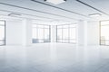 Modern spacious empty light hall room with big windows, ceramic tiles on the floor and lights on top Royalty Free Stock Photo