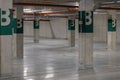 Modern, spacious and empty parking facility, featuring industrial design and smooth concrete flooring Royalty Free Stock Photo