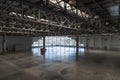 Modern spacious hangar for exhibitions and fairs. Steel frame and large windows. Warehouse or warehouse for storage of