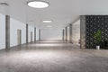 Modern spacious office area with white ceiling and walls, marble floor, wooden doors, green plant tree in white pot and glass