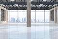 Modern spacious wooden and concrete industrial warehouse interior with city view and daylight. Royalty Free Stock Photo