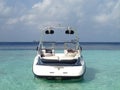 Modern speed boat in the lagoon of tropical island in the Indian Ocean, Maldives