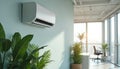 Modern split air conditioner mounted on a light blue wall in a bright office. Large windows with sunlight stream in, illuminating Royalty Free Stock Photo