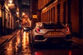 Modern Sports car at night on an old cobbled wet street