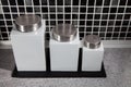 Modern square design storage jars on work surface in black and w