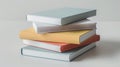 Stack of Pastel-Colored Books on White Background Royalty Free Stock Photo