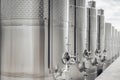 Modern stainless steel barrels for wine fermentation at a winery. Wine industry.