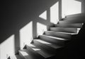 Modern staircase bathed in dramatic sunlight and shadow Royalty Free Stock Photo