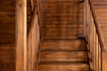 Modern staircase with wooden steps in flat. Wooden Stairway goes up. Country wooden house is spacious on two levels. Royalty Free Stock Photo