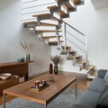 Modern stairs with silver elements in living room with wooden decor Royalty Free Stock Photo