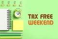 Stationery and text TAX FREE WEEKEND on green background, flat lay Royalty Free Stock Photo