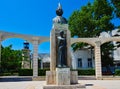 Modern Statue and Old Lighthouse, Constanta Waterfront, Romania Royalty Free Stock Photo