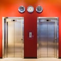 Modern steel elevator cabins with closed door in a business lobby