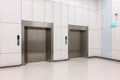 modern steel elevator cabins with closed doors at business lobby Royalty Free Stock Photo