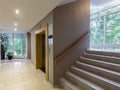 Modern steel elevator. Stairs, interior, office. perspective wide angle. Royalty Free Stock Photo