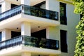 modern steel picket and glass terrace balustrade closeup. stucco and granite exterior wall elevation. Royalty Free Stock Photo