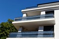 modern steel picket and glass terrace balustrade closeup. white stucco exterior wall elevation. Royalty Free Stock Photo