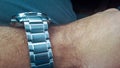 Modern steel watch on hand. Luxury fashion, watch on wrist, Ellegance guy Royalty Free Stock Photo