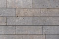 Modern stone facade texture of smooth natural stone plates at modern building facade