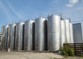 Modern  storage technology agro-industry, metal containers for grain business  granary trail perspective . Grain-drying Royalty Free Stock Photo
