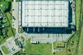 Modern storage warehouse with trucks on parking lot. aerial view Royalty Free Stock Photo