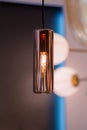 Modern streamlined copper chandelier. Glass shaped pendant lamp interesting form