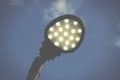 A modern street lamp against a blue sky. Royalty Free Stock Photo