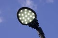 A modern street lamp against a blue sky. Royalty Free Stock Photo
