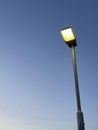 Street lamp glowing on dusk