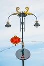 Modern street style lamp with a decor in the form of a Chinese lantern against the sky, street light. Miri, Borneo, Sarawak, Malay Royalty Free Stock Photo