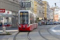 A modern streetcar rides down Vienna\'s main street in summer, close-up Austria, Vienna, August 25, 2023.