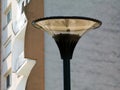 Modern style circular street lamp head and apartment exterior background Royalty Free Stock Photo