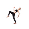 Modern style dancer posing hodling leg on studio white background Royalty Free Stock Photo