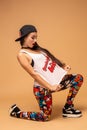 Modern style dancer posing on studio background. Hip hop, jazz funk, dancehall Royalty Free Stock Photo