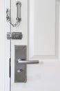 Modern style metal locked with chain and door knob. Royalty Free Stock Photo
