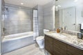 Modern stylish condo bathroom design with gray tiling