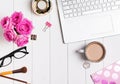 Modern stylish feminine workplace with coffee and roses Royalty Free Stock Photo