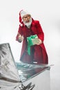 Modern stylish Santa Claus in red fashionable suit isolated on white background Royalty Free Stock Photo