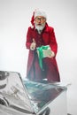 Modern stylish Santa Claus in red fashionable suit isolated on white background Royalty Free Stock Photo