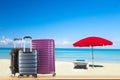 Modern suitcases baggage for travelling or business trip on wooden floor against amazing beach ocean coast background with sun