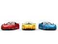 Modern super sports cars in primary colors - red, yellow and blue - front view